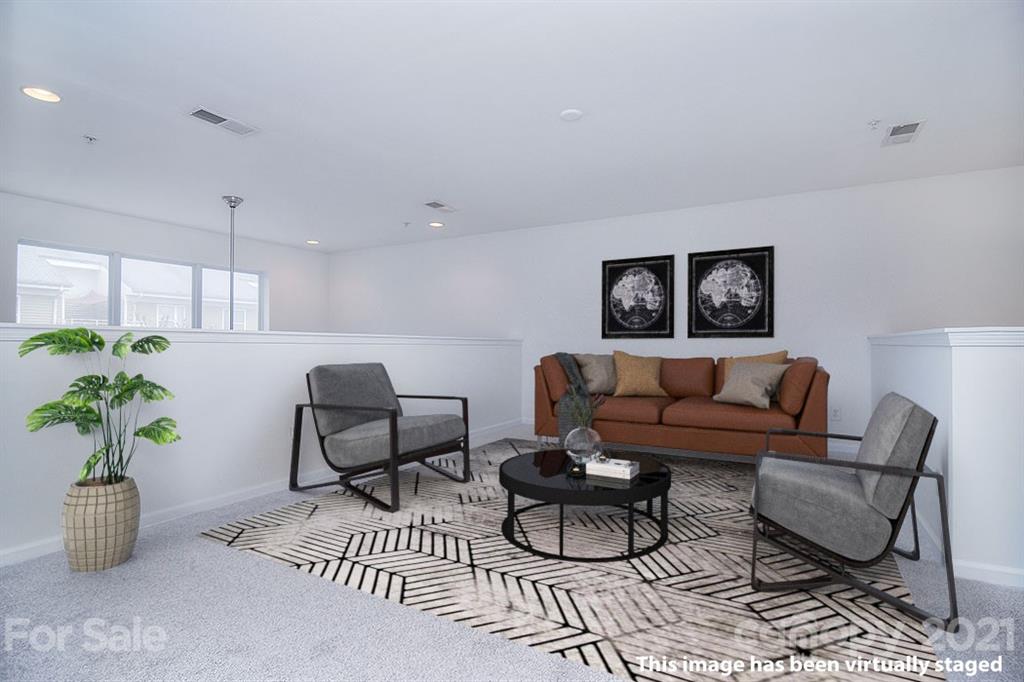 610 Raphael Place Charlotte, NC 28205 - Photo 21 of 27 a living room with furniture potted plant and a window