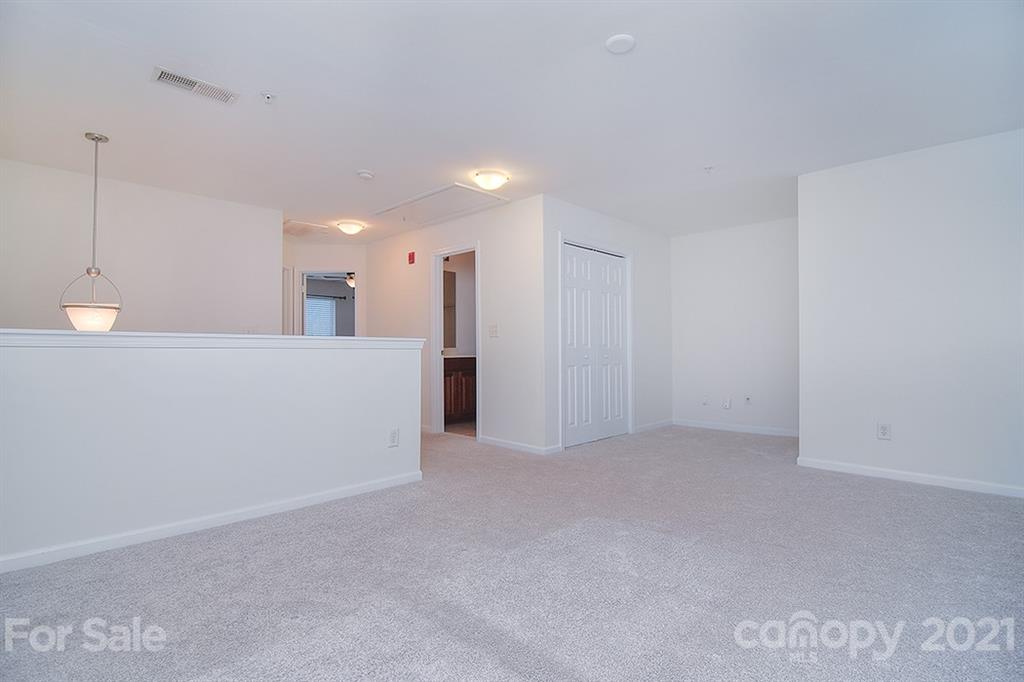 610 Raphael Place Charlotte, NC 28205 - Photo 22 of 27 a view of an empty room with a kitchen