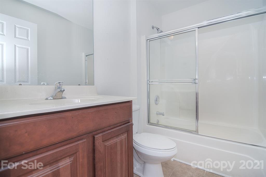 610 Raphael Place Charlotte, NC 28205 - Photo 24 of 27 a bathroom with a sink toilet and shower