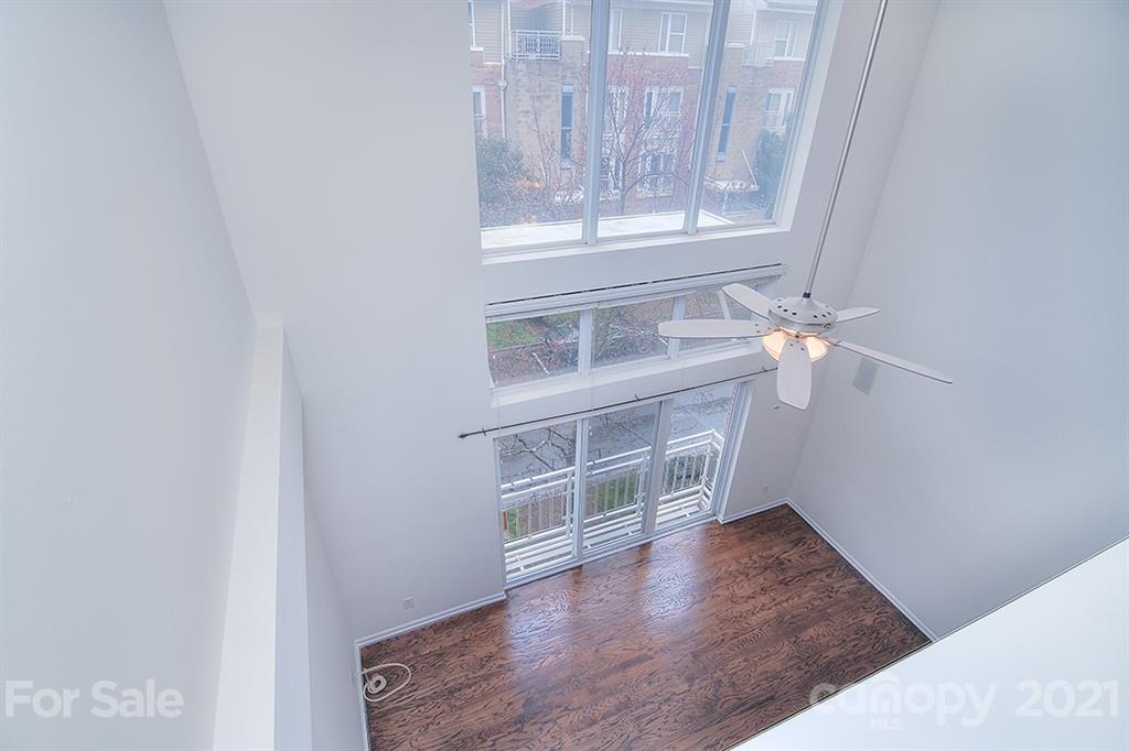 610 Raphael Place Charlotte, NC 28205 - Photo 26 of 27 a view of an empty room with wooden floor and a window