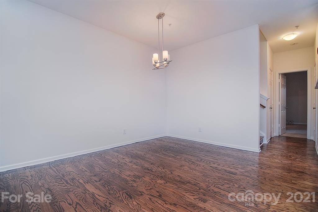 610 Raphael Place Charlotte, NC 28205 - Photo 8 of 27 a view of a room with wooden floor and ceiling fan