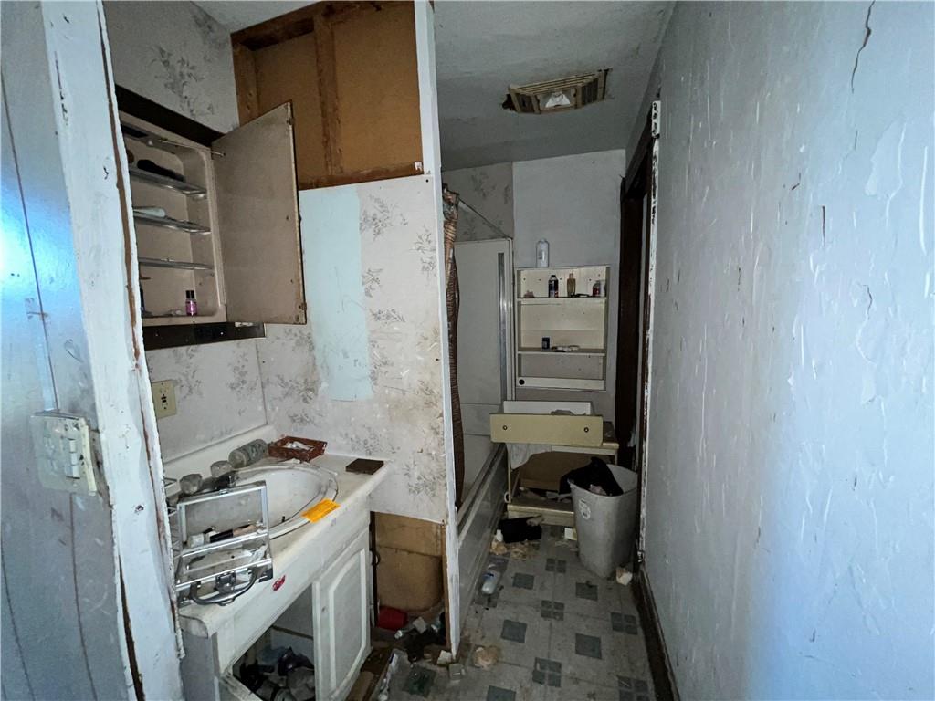 1515 Ridge Avenue Braddock, PA 15104 - Photo 9 of 12 a bathroom with a sink toilet and shower