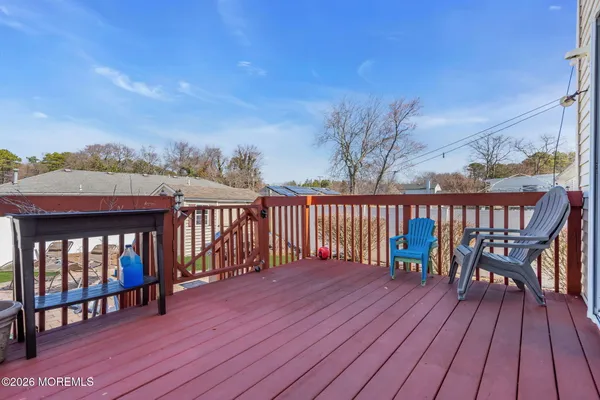 a view of a chairs on wooden deck