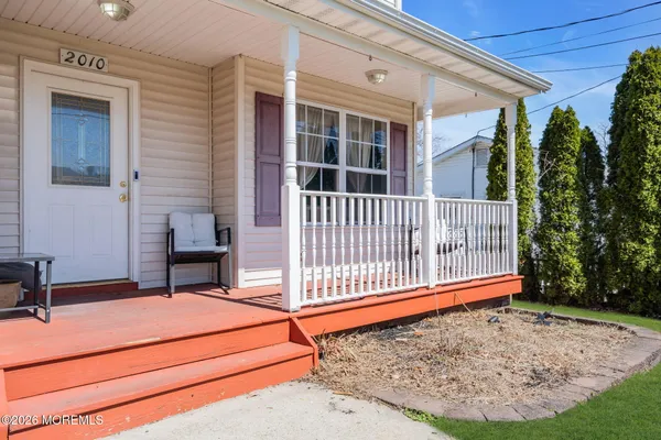 a view of backyard with deck and backyard