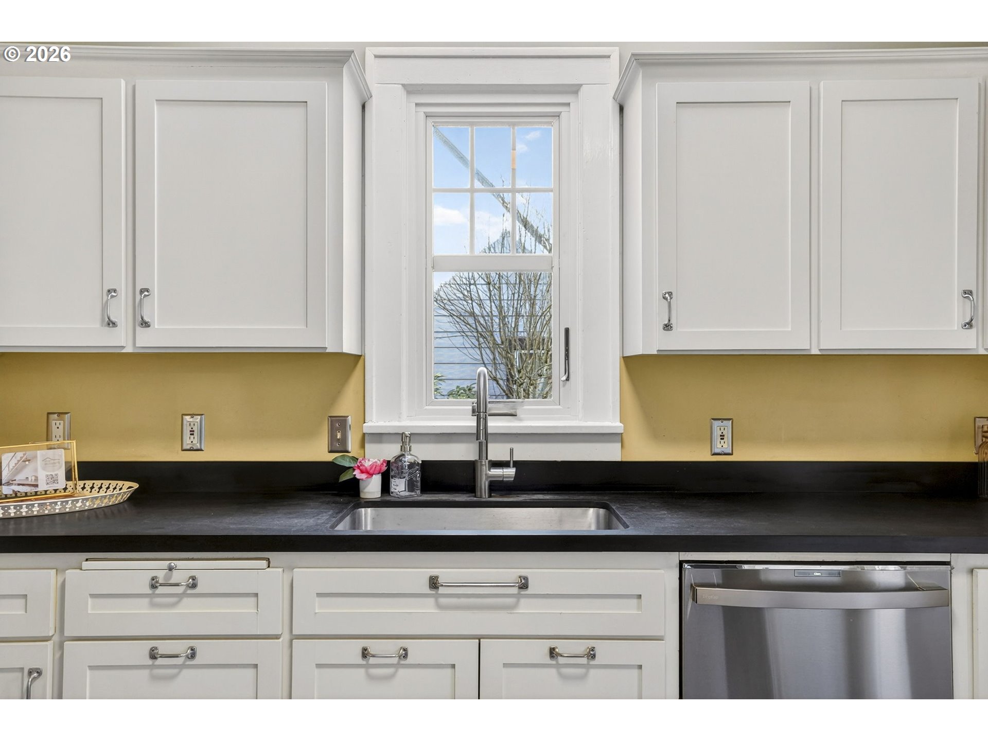 3923 Northeast 76th Avenue Portland, OR 97213 - Photo 17 of 48 a kitchen with granite countertop white cabinets and a sink