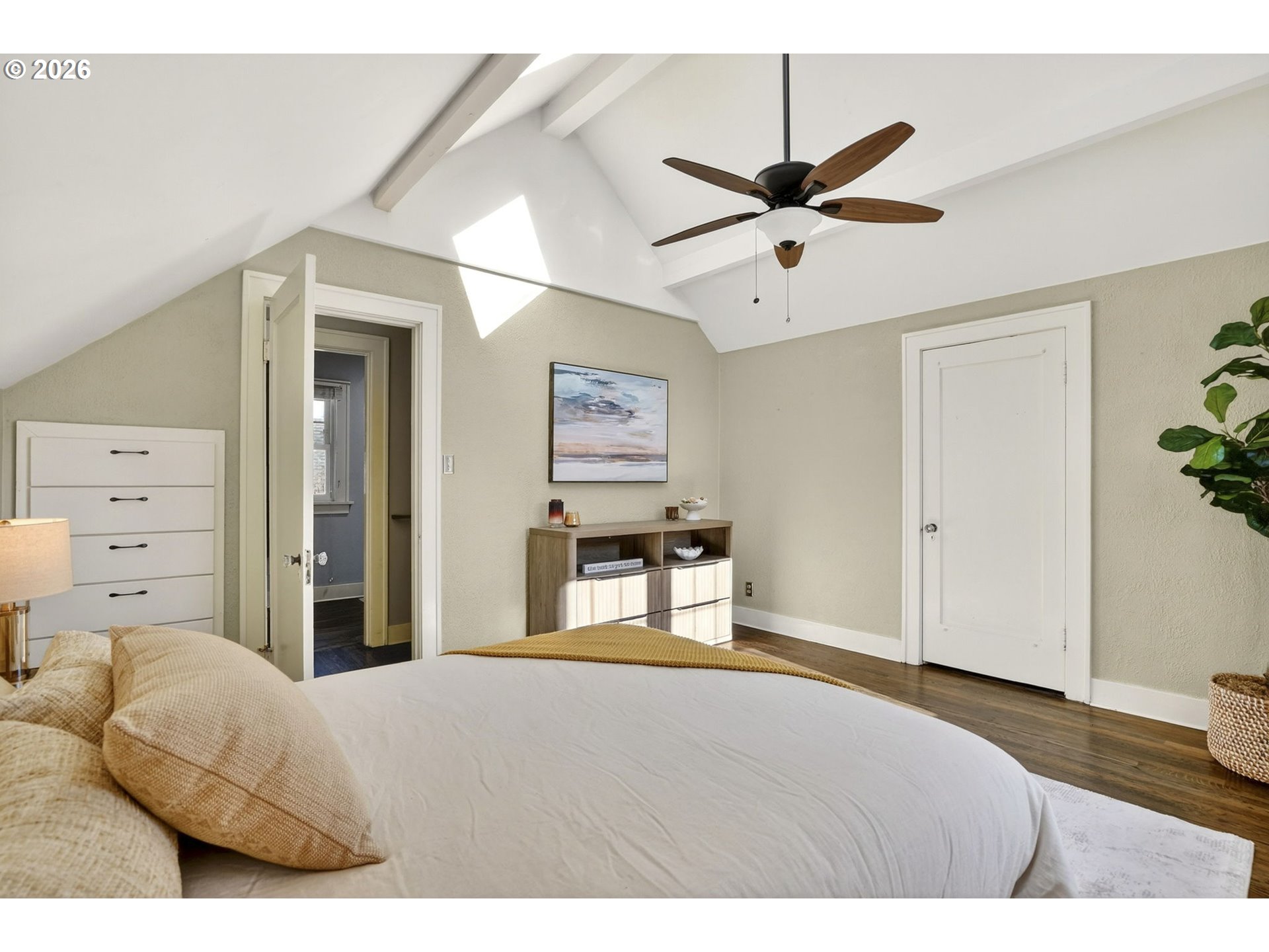 3923 Northeast 76th Avenue Portland, OR 97213 - Photo 21 of 48 a bedroom with a bed and a chandelier