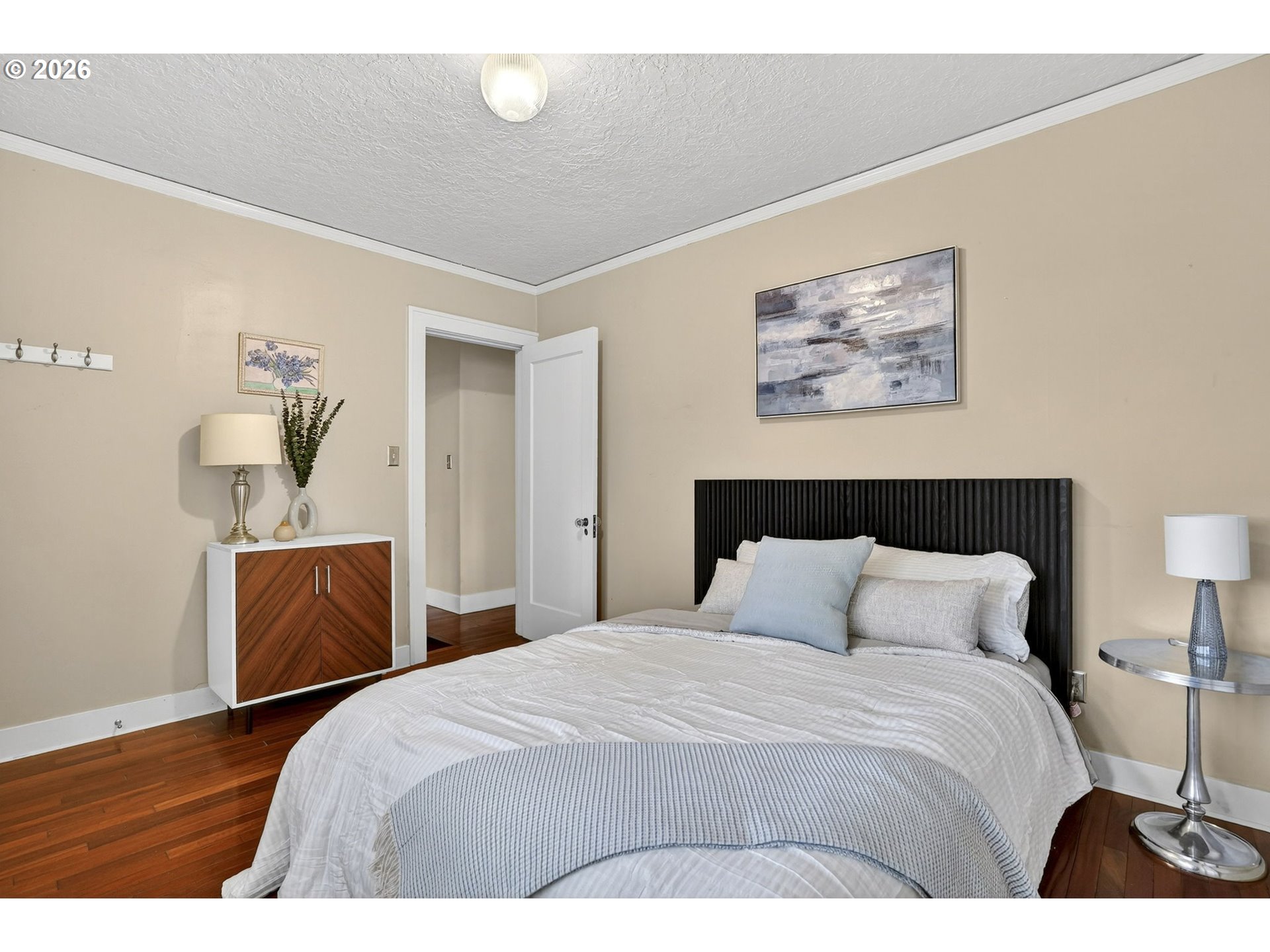 3923 Northeast 76th Avenue Portland, OR 97213 - Photo 25 of 48 a bedroom with a bed and wooden floor