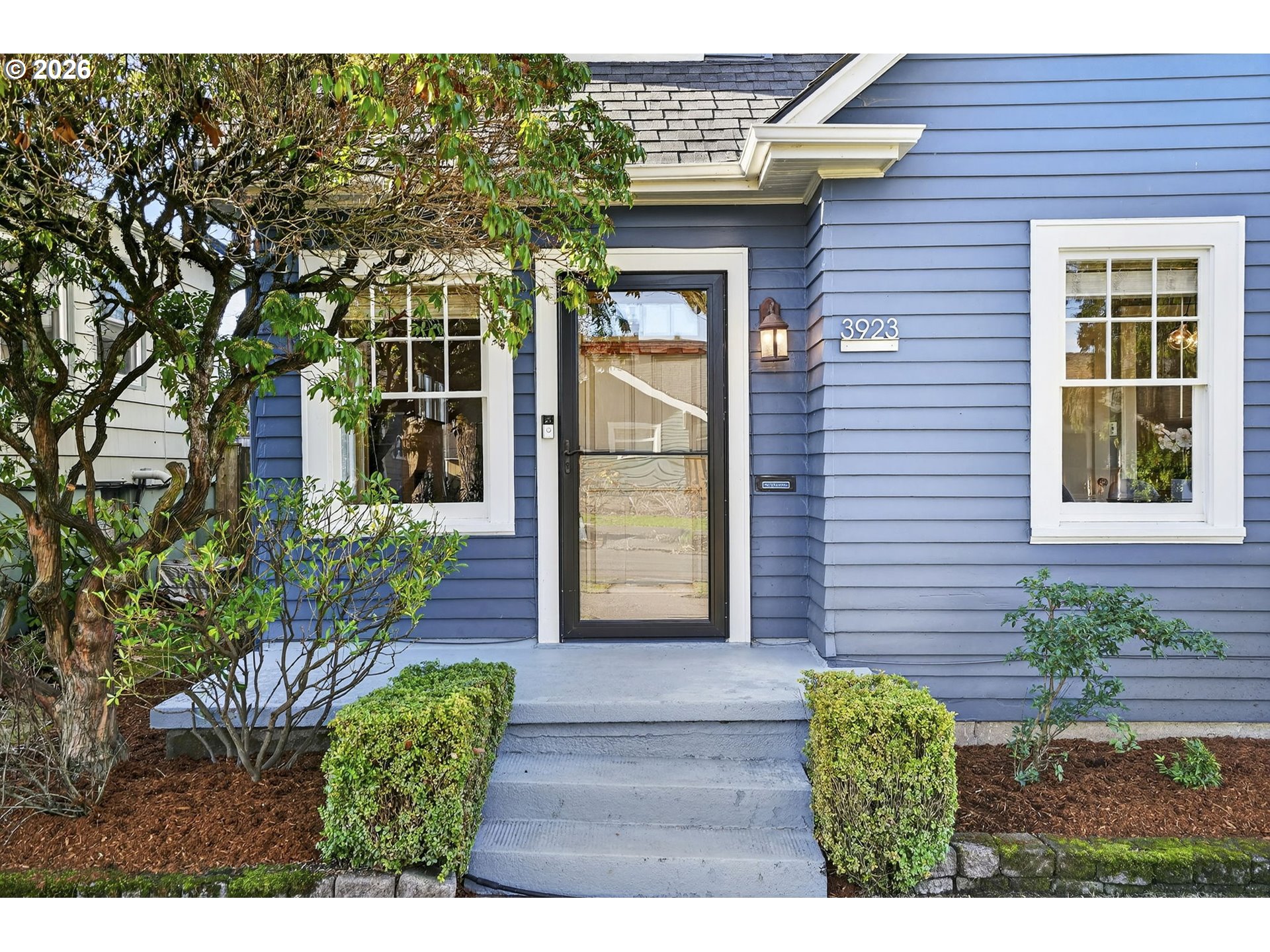 3923 Northeast 76th Avenue Portland, OR 97213 - Photo 4 of 48 a front view of a house with a garden
