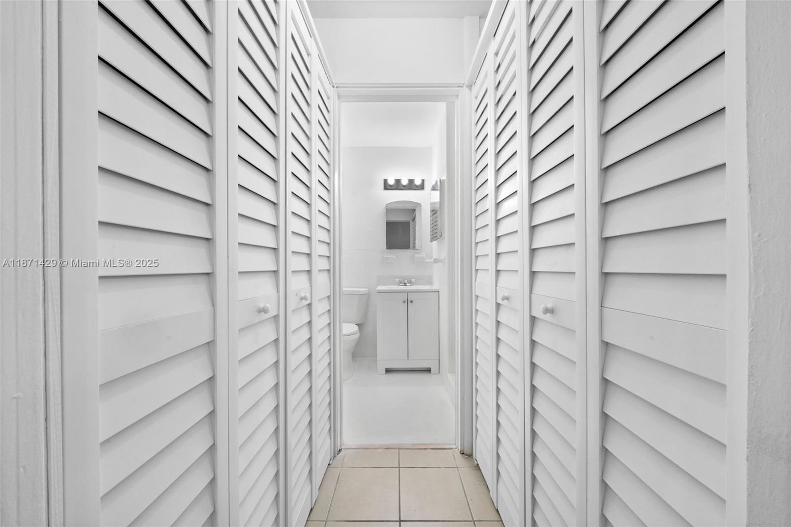840 Southwest 7th Street, Unit 844 Miami, FL 33130 - Photo 7 of 10 a view of walk in closet with empty racks