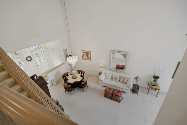 a bedroom with furniture and a wooden floor