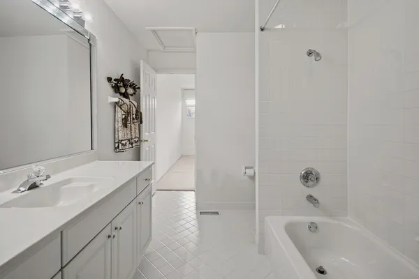 a bathroom with a bathtub and a sink