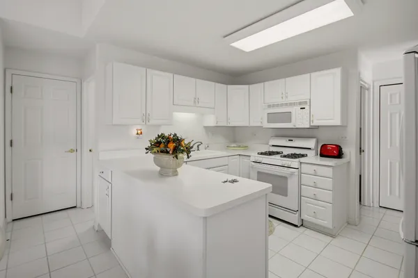 a kitchen with cabinets and appliances
