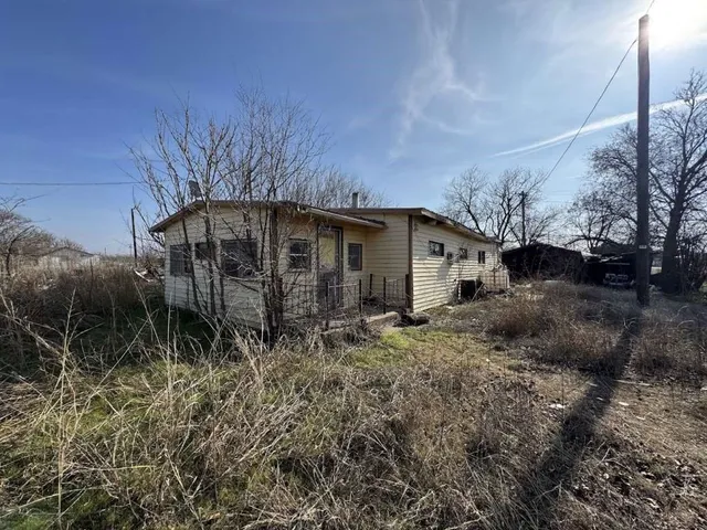 a backyard of a house with lots of green space