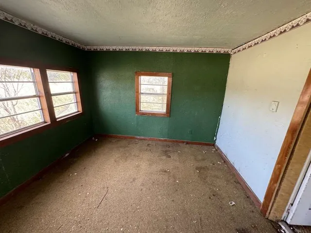 a view of an empty room and window