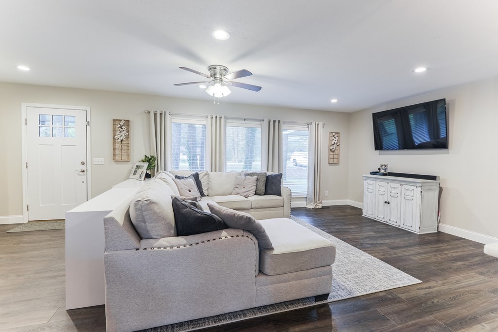 3741 Airport Road Southeast Dalton, GA 30721 - Photo 12 of 70 a living room with furniture a flat screen tv and kitchen view