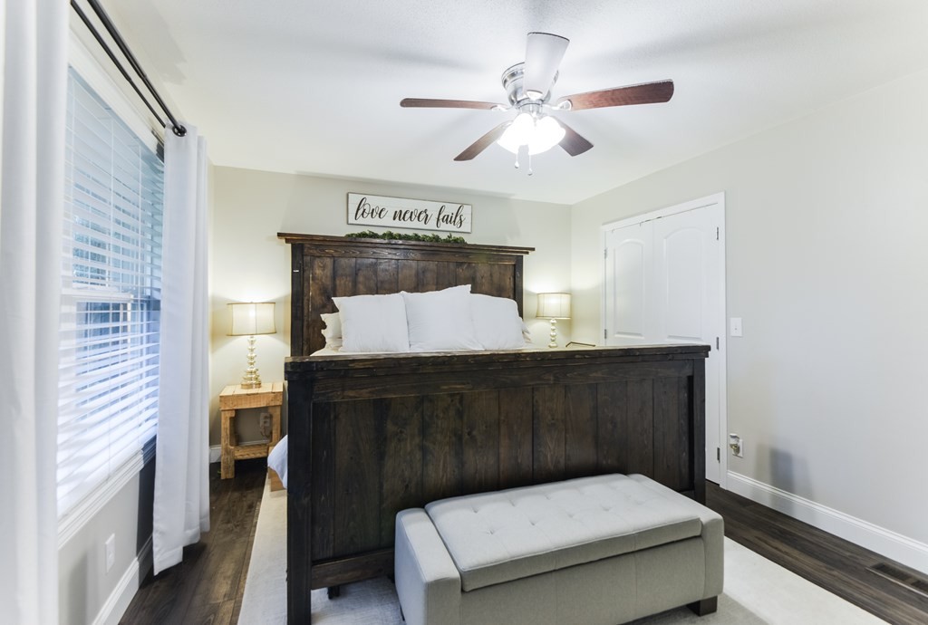 3741 Airport Road Southeast Dalton, GA 30721 - Photo 38 of 70 a bedroom with a bed and a chandelier