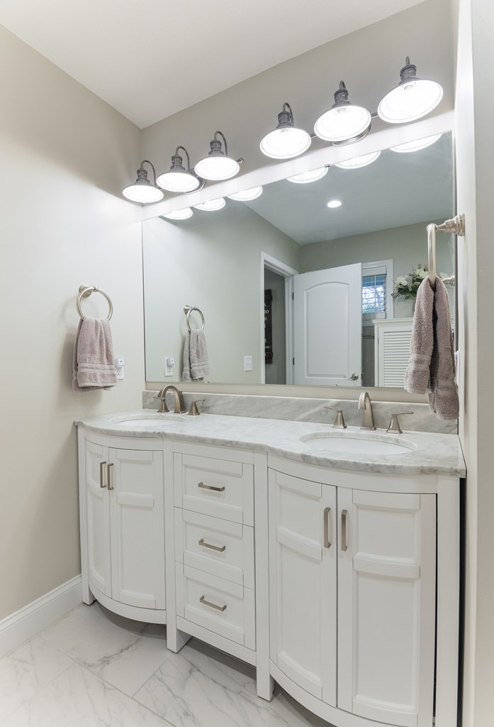 3741 Airport Road Southeast Dalton, GA 30721 - Photo 47 of 70 a bathroom with a granite countertop sink and a mirror
