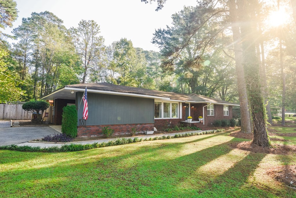 3741 Airport Road Southeast Dalton, GA 30721 - Photo 5 of 70 a view of a house with a yard patio and a tree