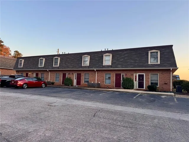 a view of a car parked in front of a building