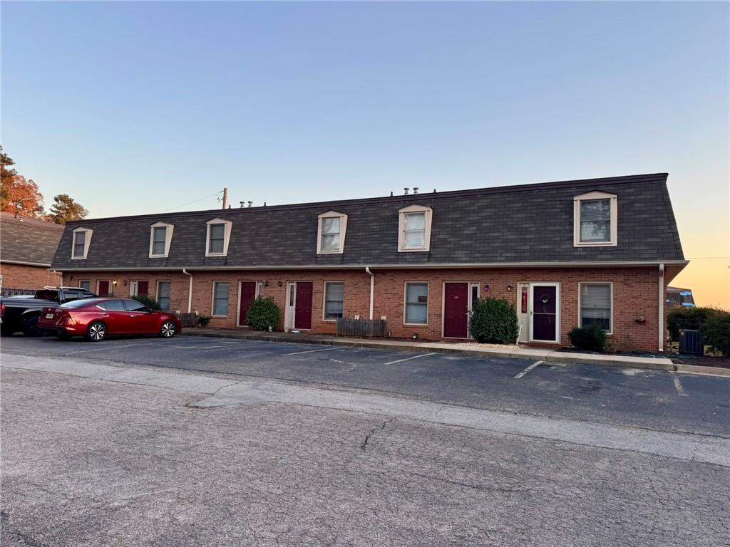 a view of a car parked in front of a building