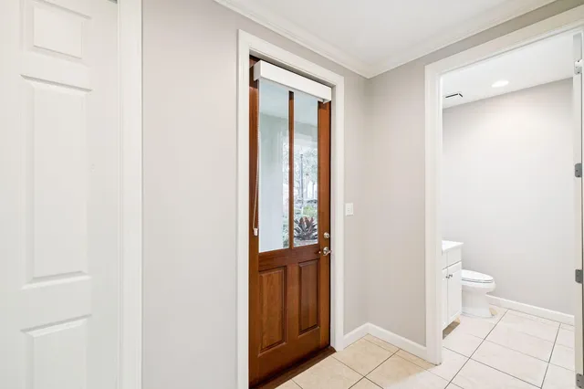 a bathroom with a sink toilet and a mirror