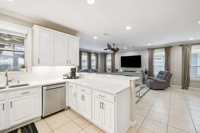 a kitchen with a refrigerator and stove