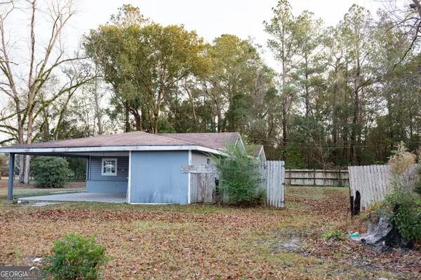 a house with trees in front of it