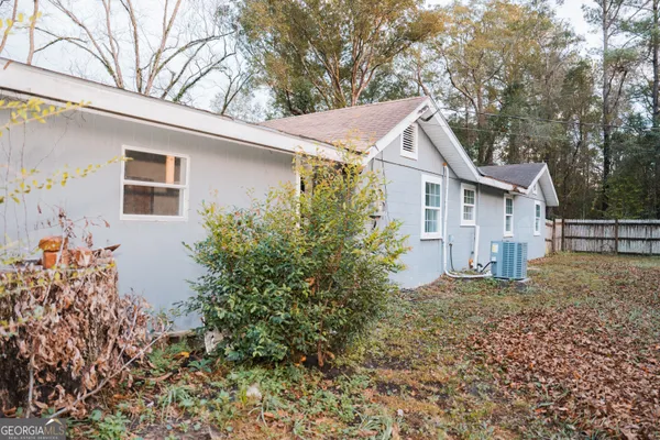 a house with trees in front of it