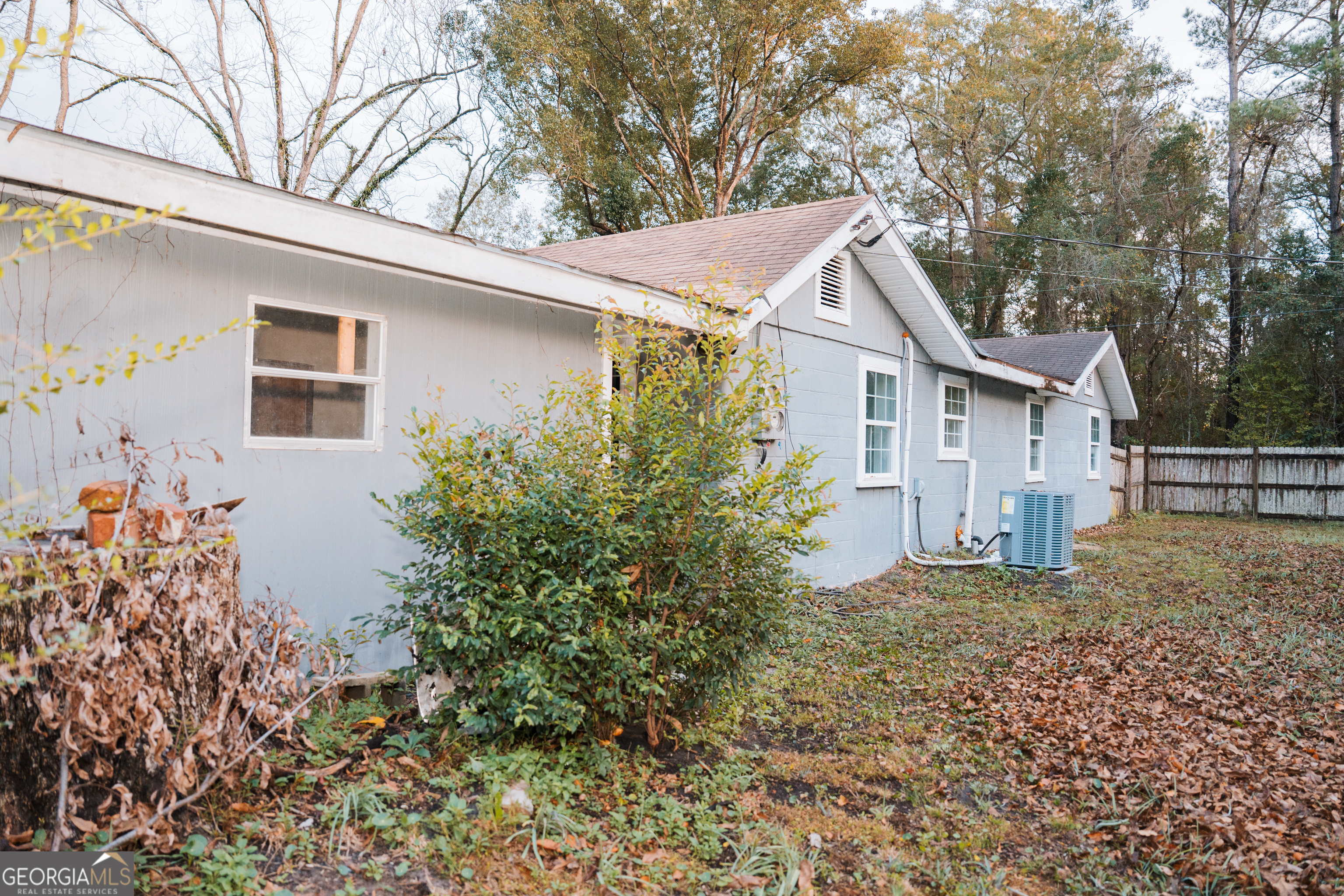 4427 Pine Valley Road Waycross, GA 31503 - Photo 3 of 24 a house with trees in front of it