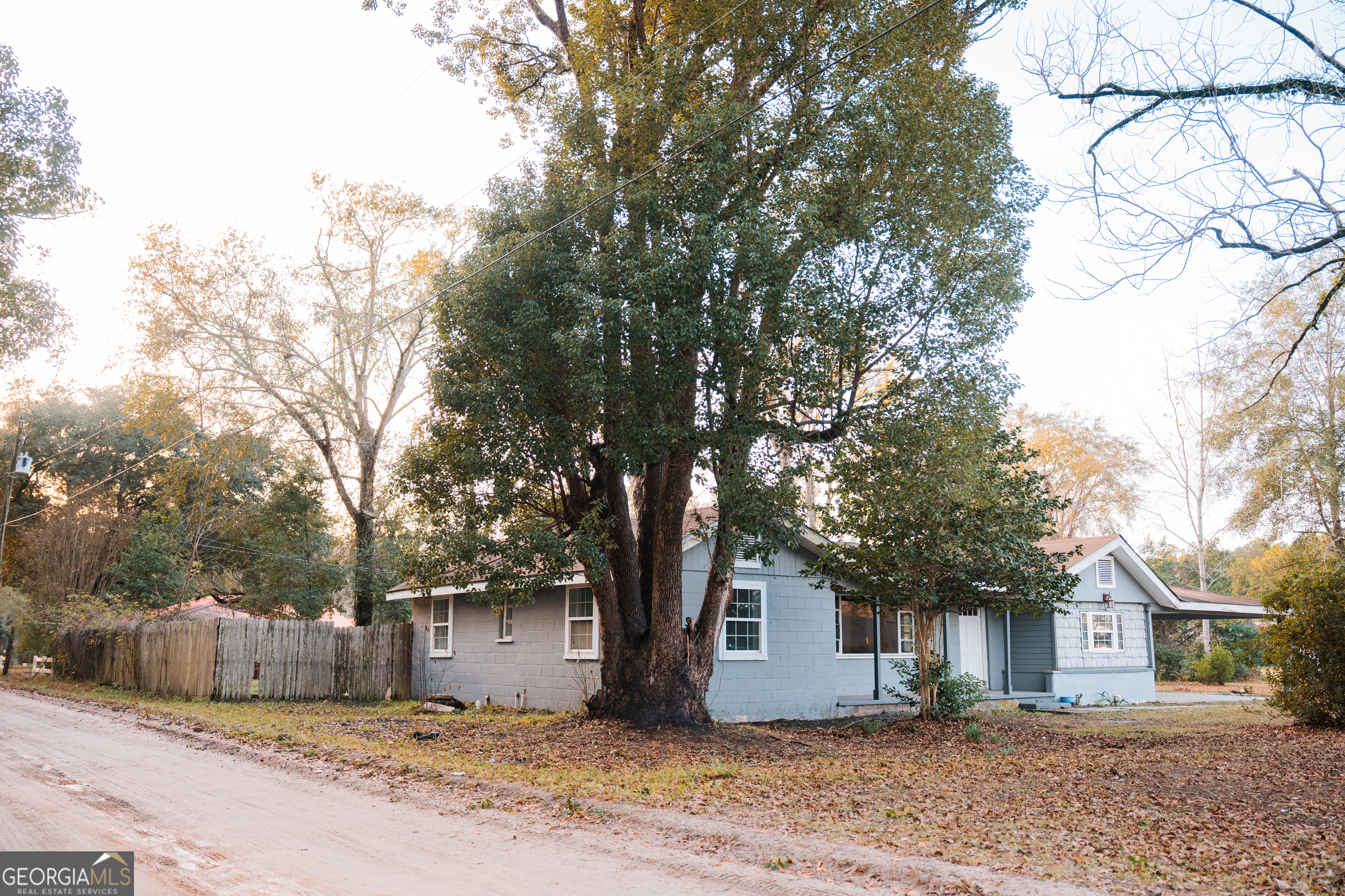 4427 Pine Valley Road Waycross, GA 31503 - Photo 5 of 24 a front view of a house with a tree