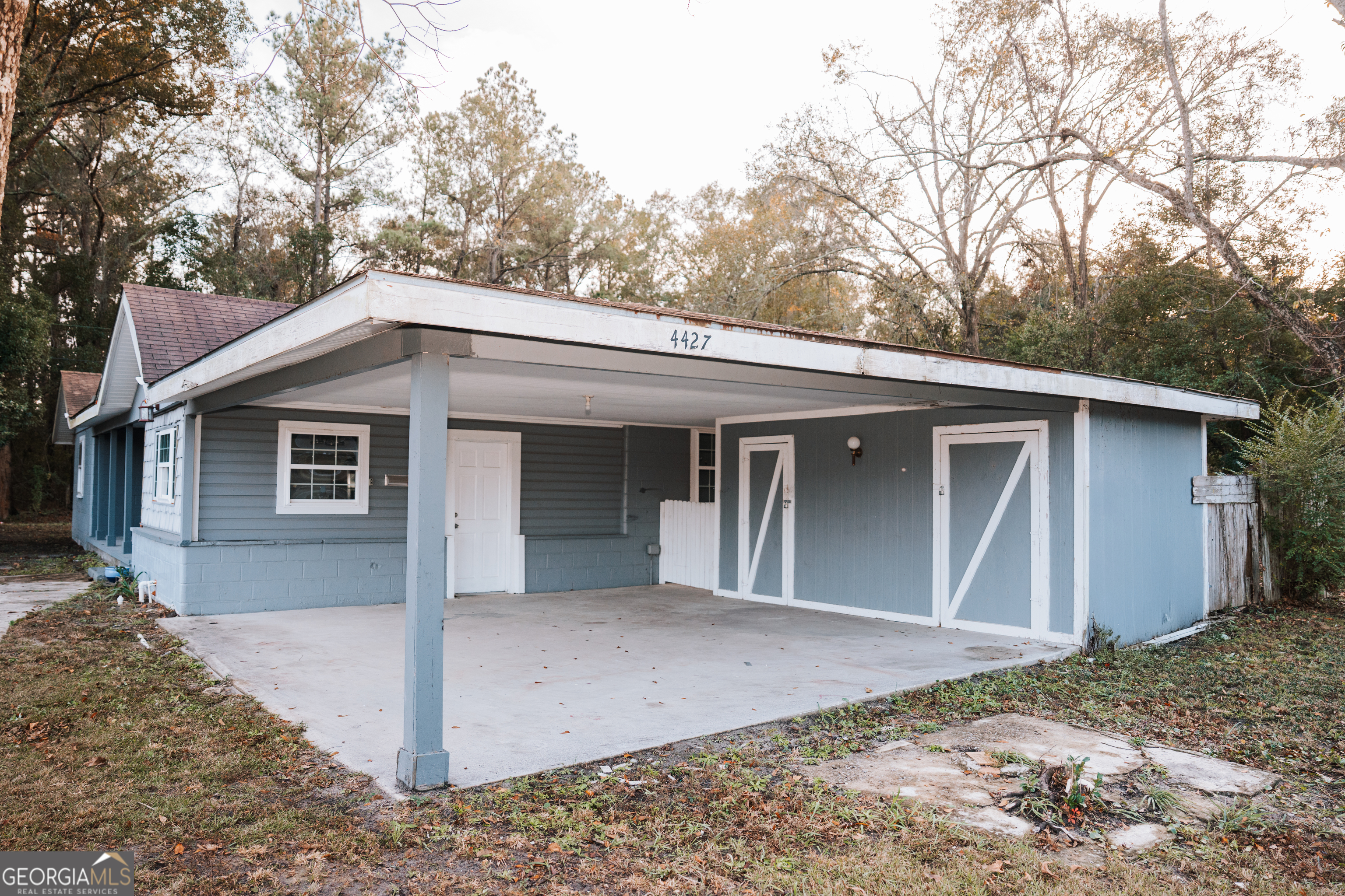 4427 Pine Valley Road Waycross, GA 31503 - Photo 7 of 24 a view of a house with a yard and large tree