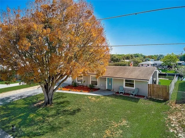an outdoor space with furniture and garden