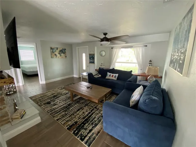 a bed sitting in a bedroom next to a bathroom