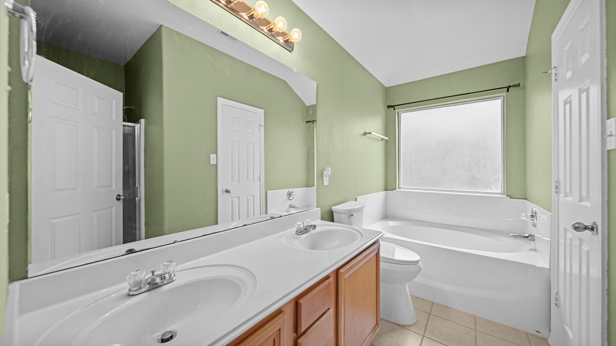 213 Mesa View Conroe, TX 77316 - Photo 12 of 19 a bathroom with a sink and a mirror