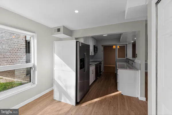 a view of a kitchen from the hallway