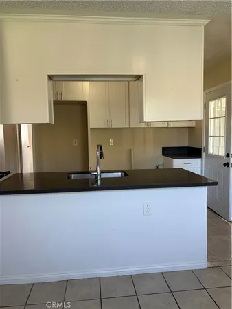 a kitchen with a counter top space and cabinets