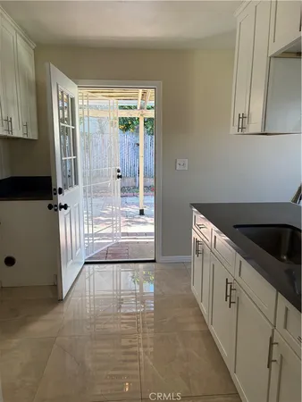 a view of a kitchen with a sink and an oven