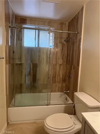a bathroom with a toilet and a bathtub