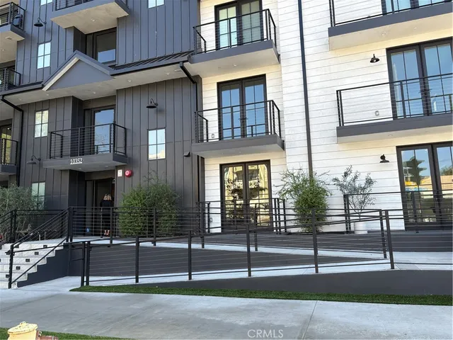 a view of a brick building with many windows