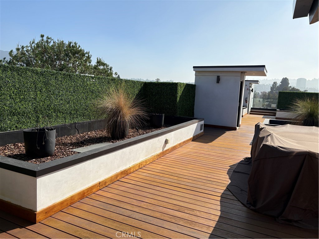 10352 Riverside Drive, Unit 201 Toluca Lake, CA 91602 - Photo 42 of 49 a bedroom with a bed and a television