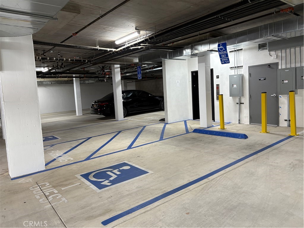 10352 Riverside Drive, Unit 201 Toluca Lake, CA 91602 - Photo 47 of 49 a view of an empty room with wooden floor
