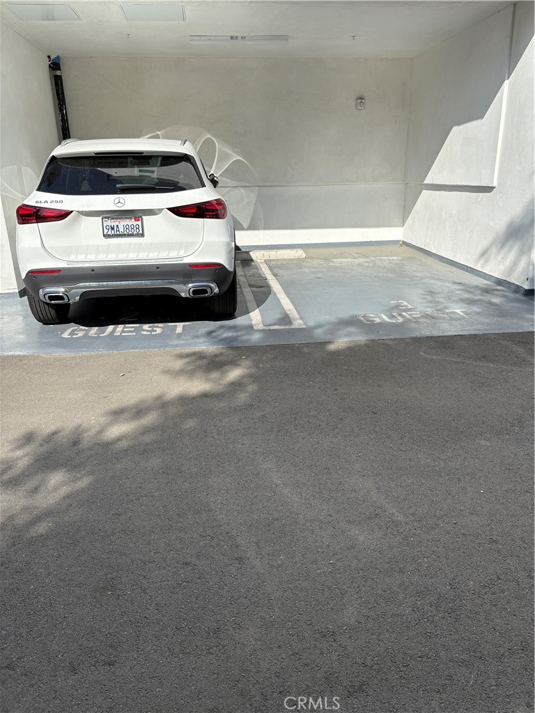 10352 Riverside Drive, Unit 201 Toluca Lake, CA 91602 - Photo 48 of 49 a car parked on the side of a road