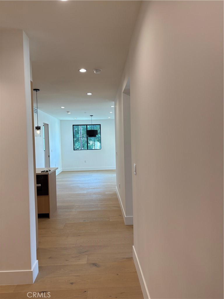 10352 Riverside Drive, Unit 201 Toluca Lake, CA 91602 - Photo 9 of 49 a view of hallway with a window