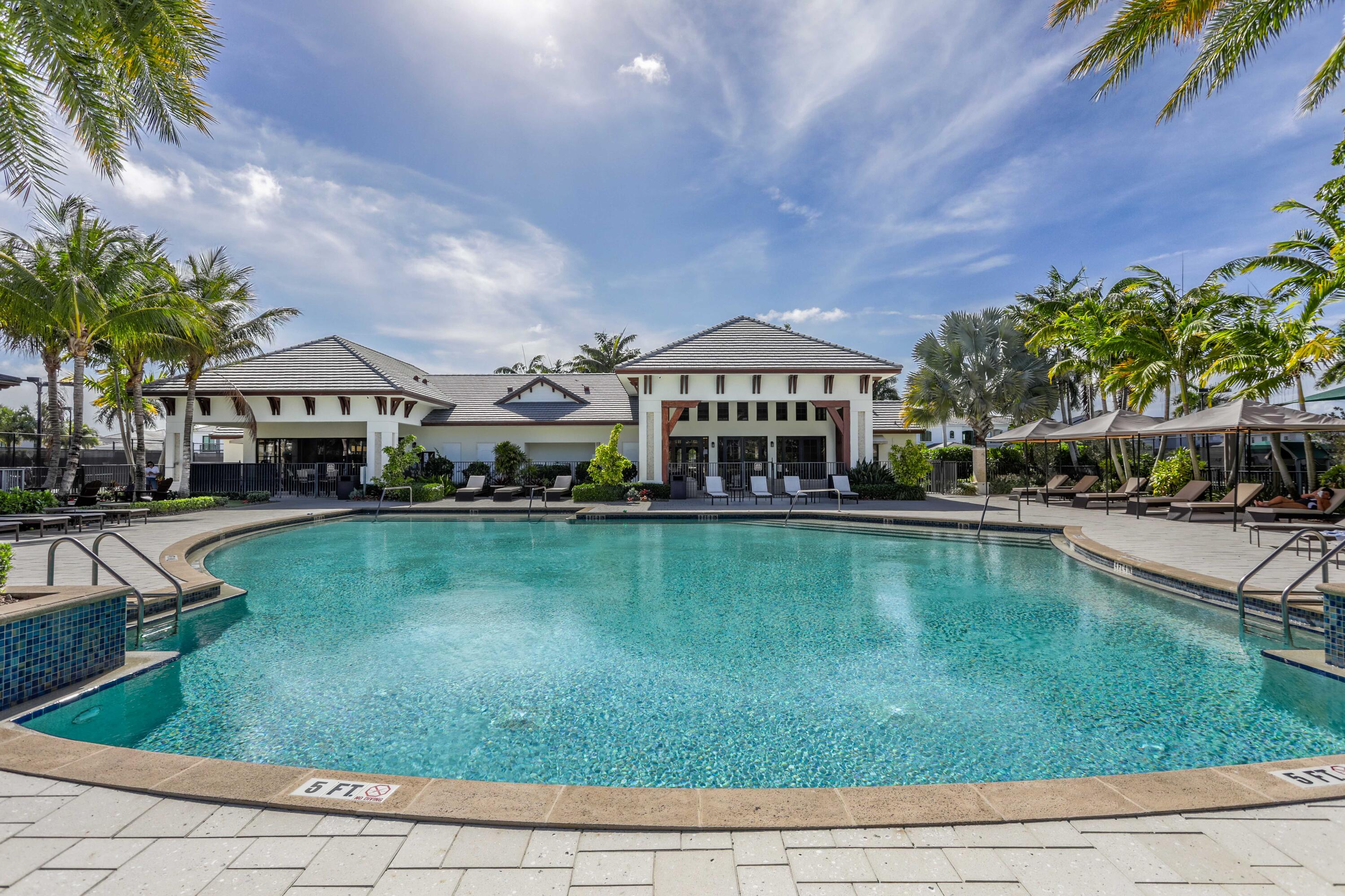 6903 Northwest 28th Avenue Boca Raton, FL 33496 - Photo 63 of 69 a view of a house with a swimming pool