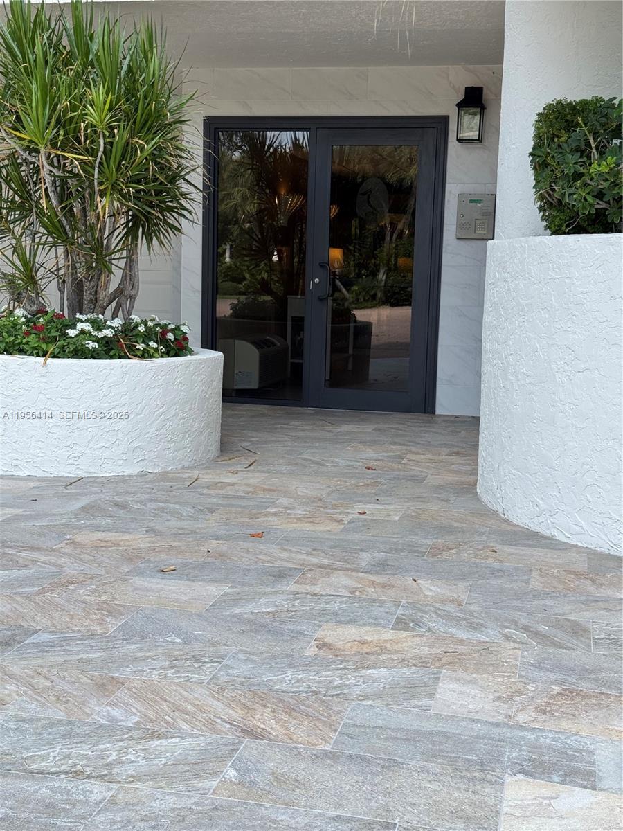 290 Celestial Way, Unit 2 Juno Beach, FL 33408 - Photo 4 of 41 Coded Security Building Entry Doors, Updated facade