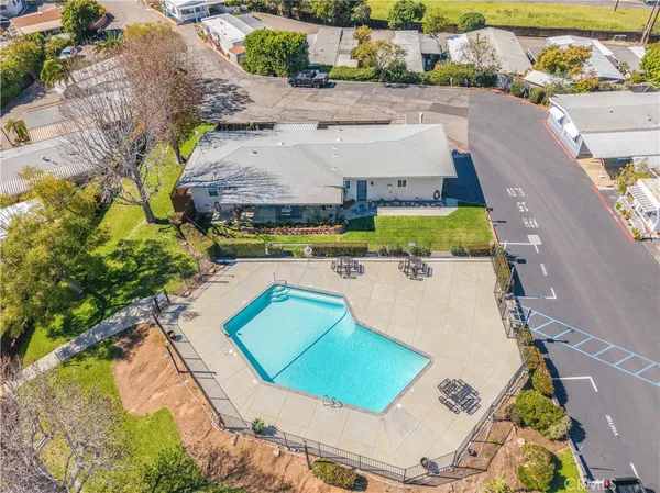 an aerial view of a house with a swimming pool