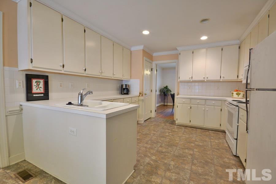 3723 Pickett Road Durham, NC 27705 - Photo 11 of 25 with a ton of cabinet space and counter space