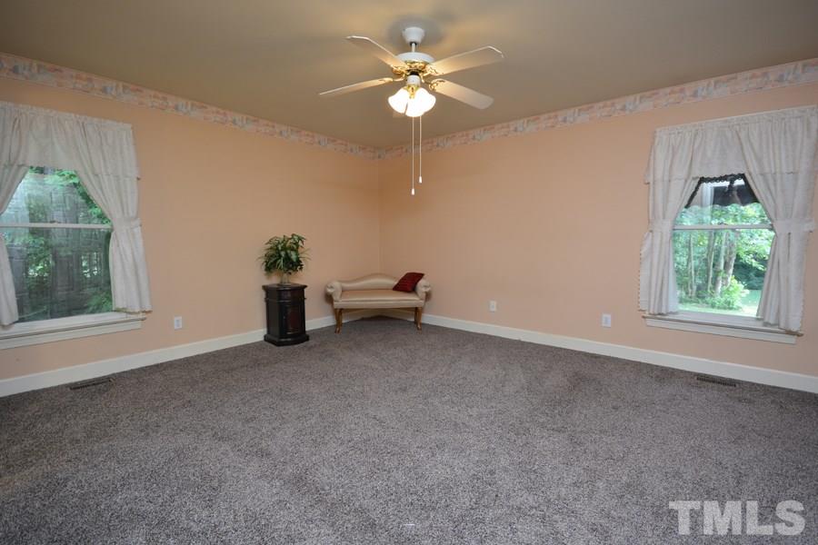 3723 Pickett Road Durham, NC 27705 - Photo 17 of 25 with 2 windows over looking wood lined back yard - total privacy and quiet as can be