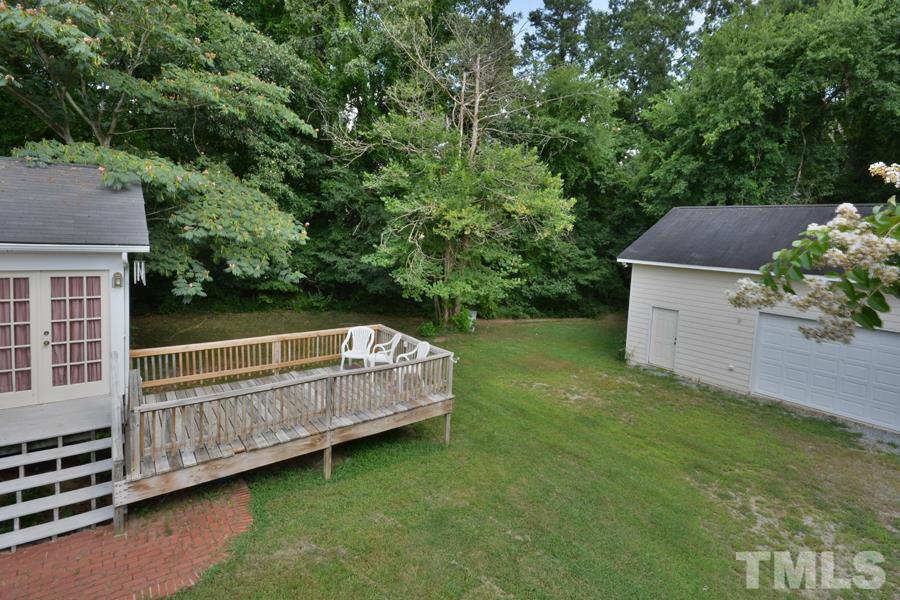 3723 Pickett Road Durham, NC 27705 - Photo 3 of 25 with rear deck and patio as well as separate wired workshop (in addition to attached double garage)