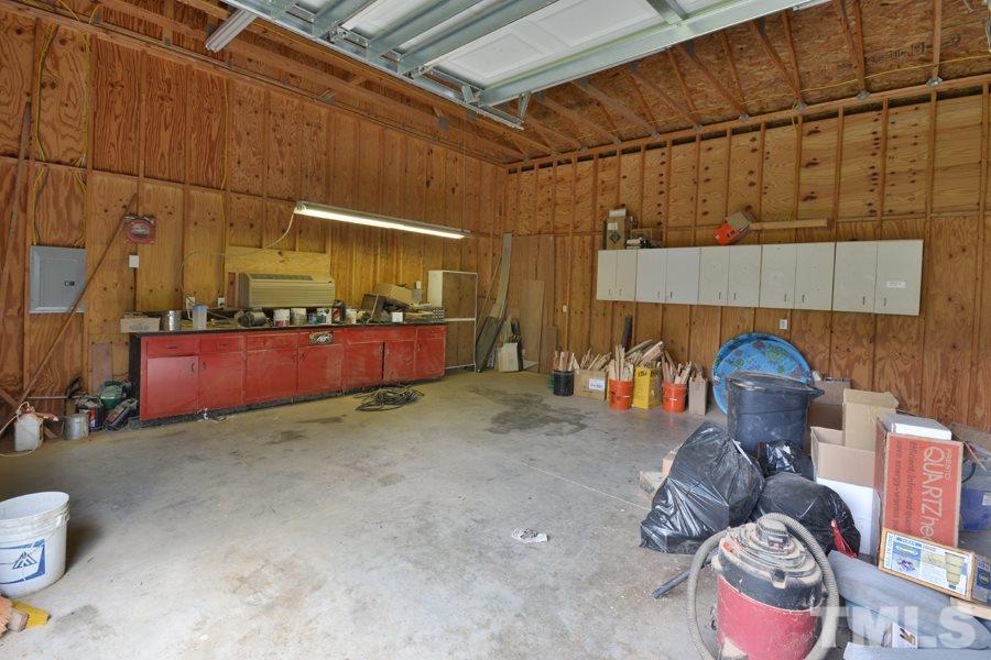 3723 Pickett Road Durham, NC 27705 - Photo 22 of 25 Wall and floor cabinets, counters, AC unit and 240V wiring
